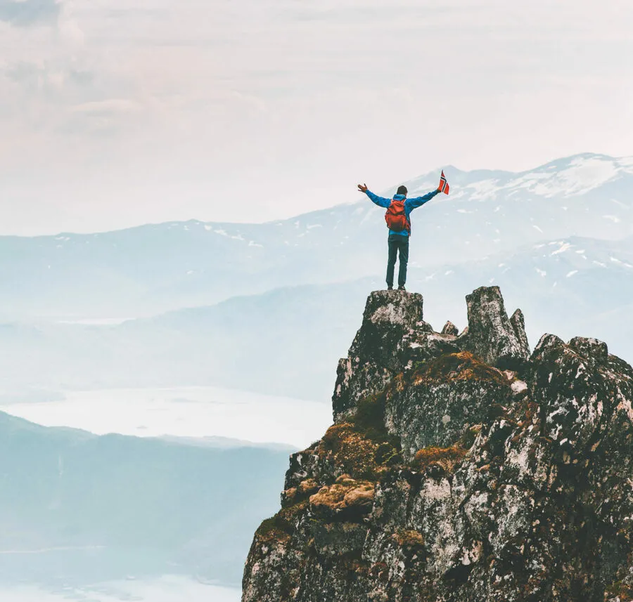Corsearch image of a man climbing a Norwegian mountain 